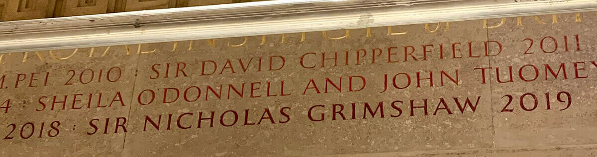 Name carving takes place on RIBA Royal Gold Medal wall / GRIMSHAW